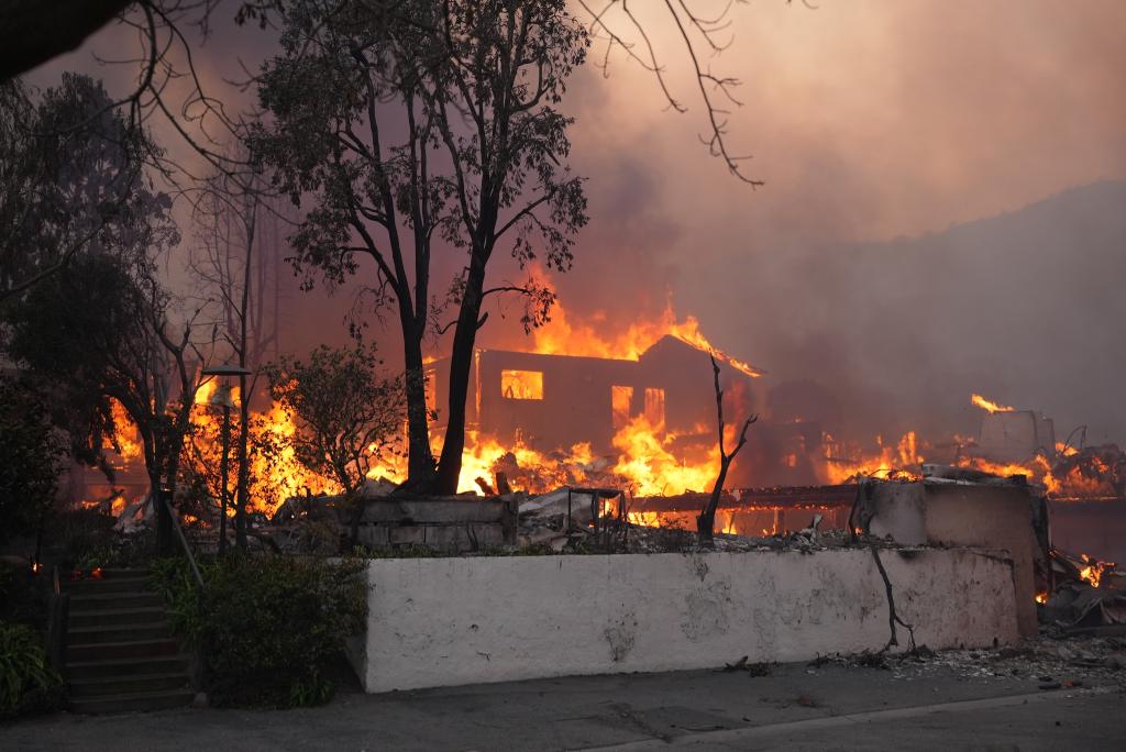 A house in Pacific Palisades engulfed in flame.